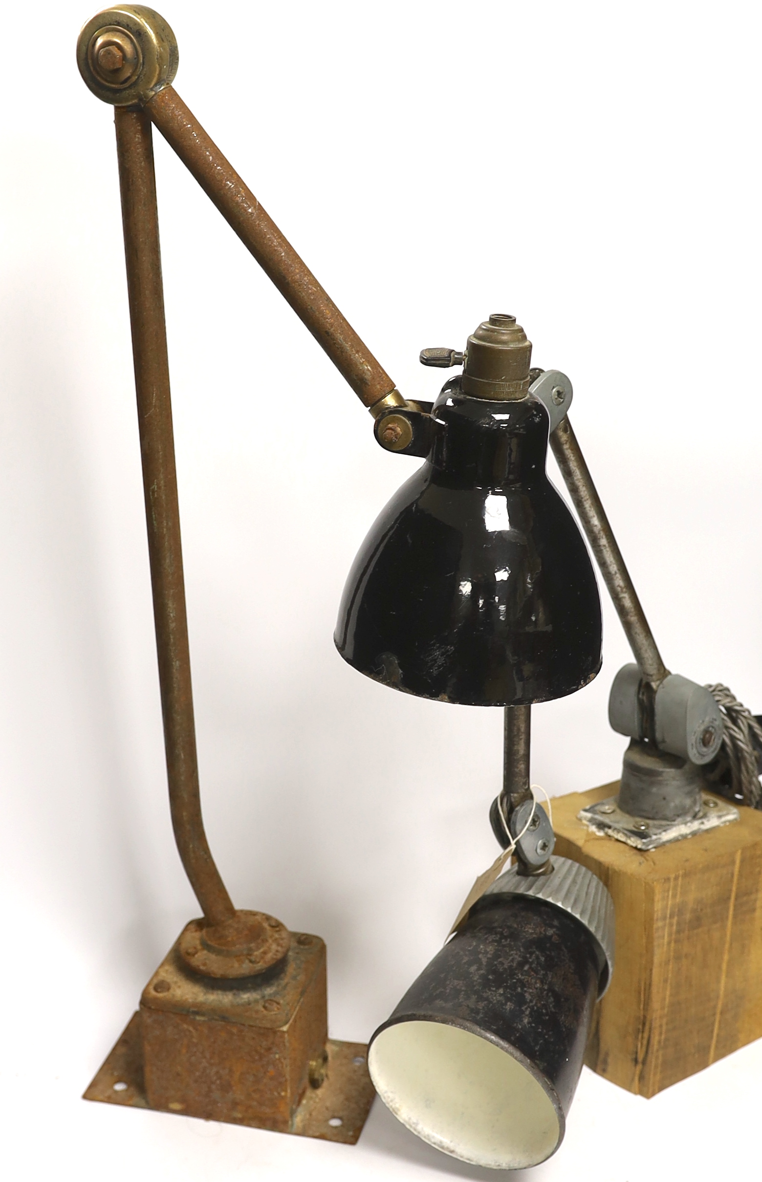 A mid-century Kaiser Idell-style scissor-action wall lamp, and two other industrial wall lamps